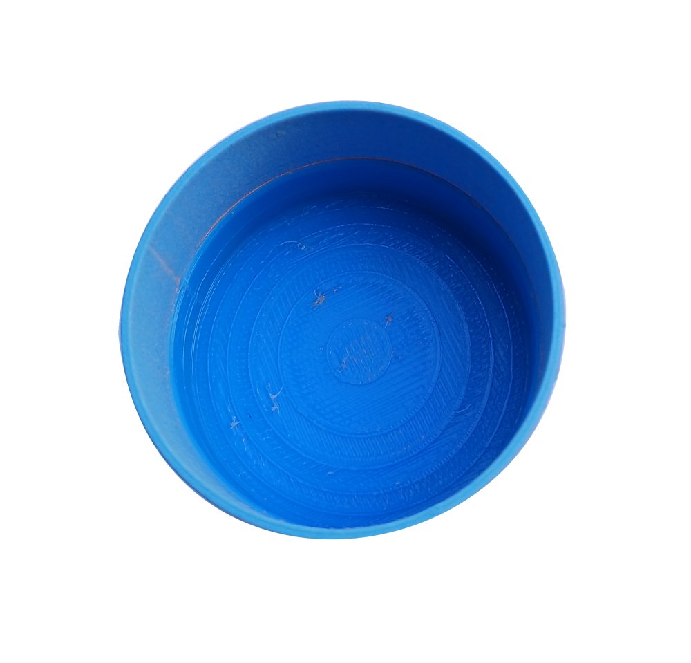 A bright blue plastic bowl viewed from directly above on a plain white background.