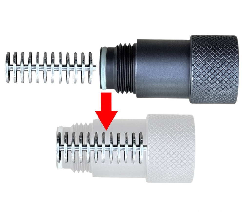 An expansion chamber adapter for CO2/HPA, shown in two states: assembled with a black body and silver spring, and disassembled with a white body and silver spring, on a white background with text reading 'EXPANSION CHAMBER FOR CO2/HPA' and 'MCSUS.COM'.
