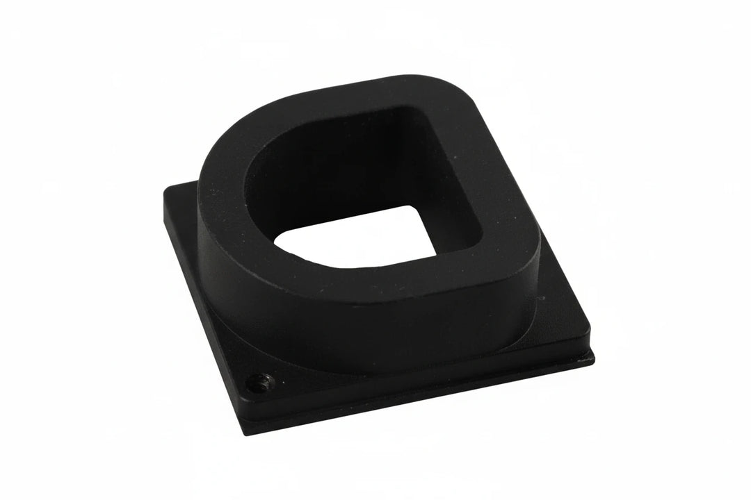 A black feed adapter for a paintball gun.