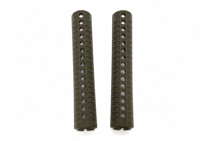 Two green tactical rifle grips on a white background