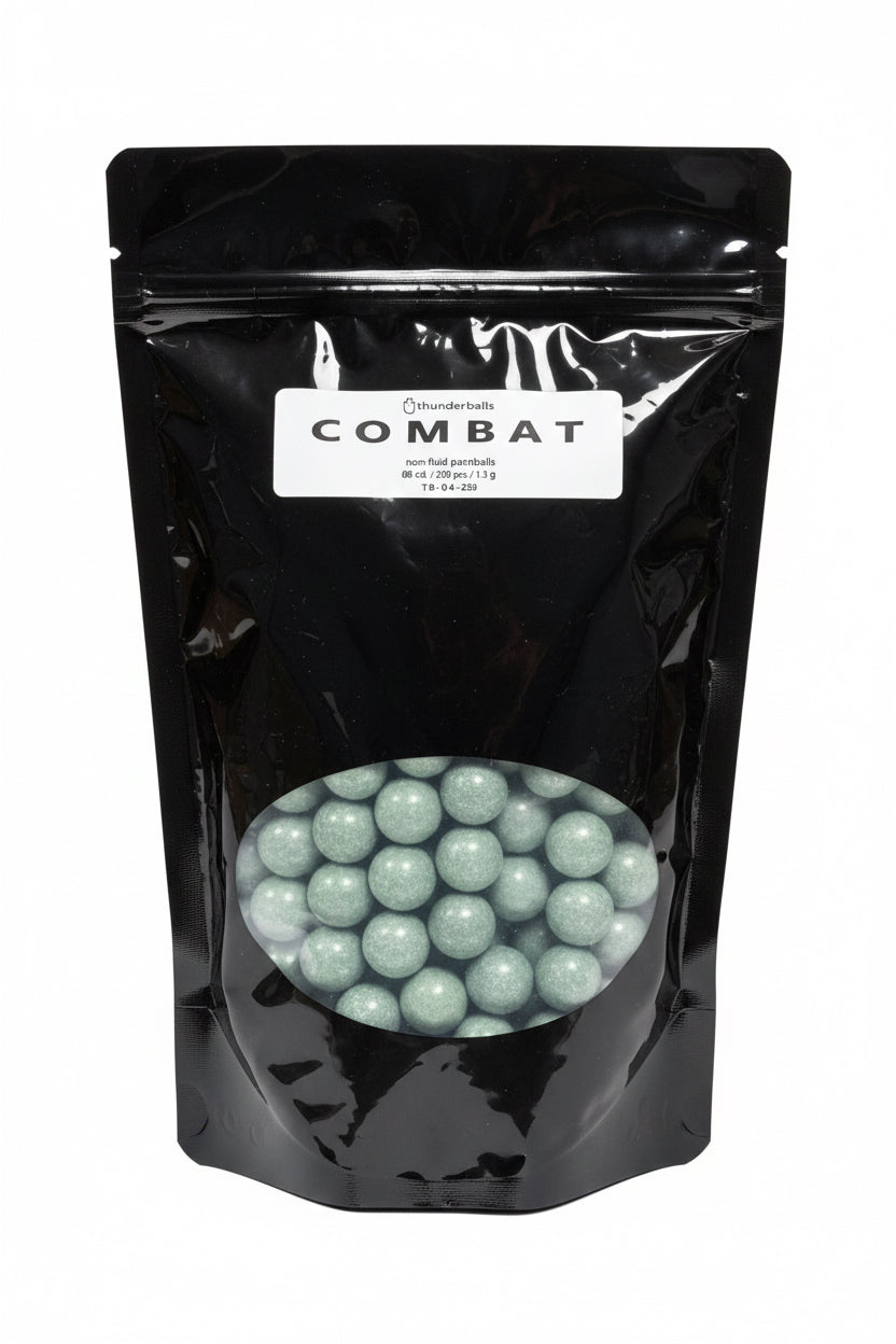 A black stand-up pouch labeled 'COMBAT' with a clear window showing round green projectiles
