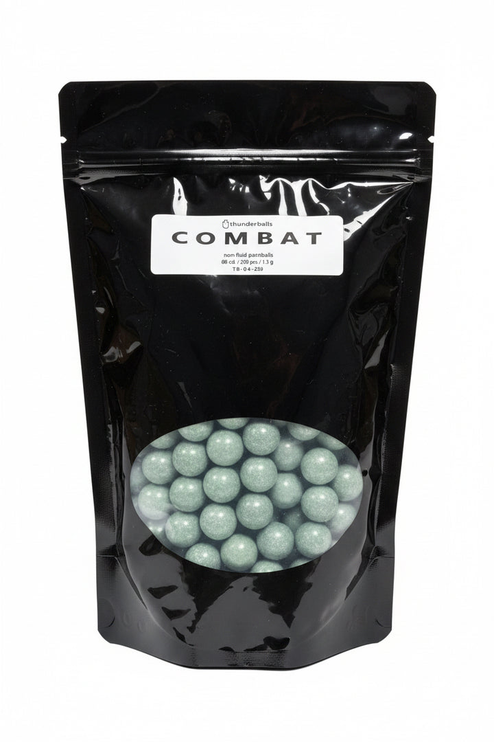 A black stand-up pouch labeled 'COMBAT' with a clear window showing round green projectiles
