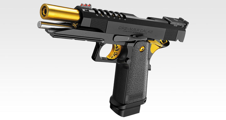 A semi-automatic pistol with a black textured grip and slide, accented by a gold-colored barrel tip, trigger guard, and magazine base, shown against a light gray gradient background.