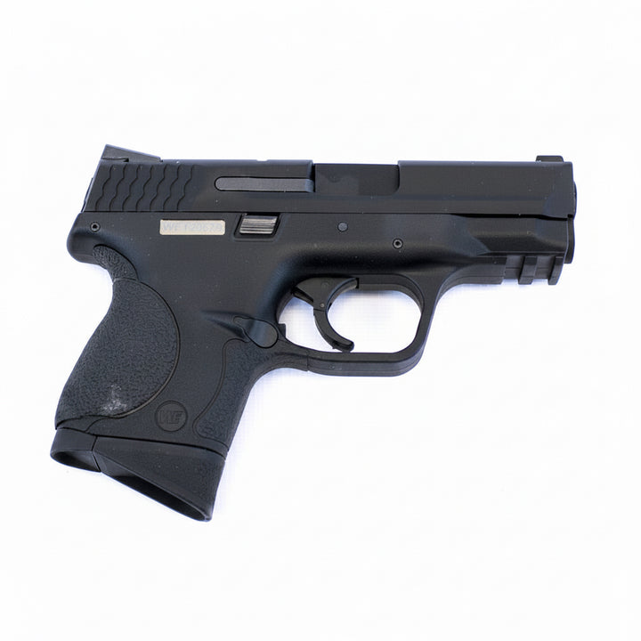 A black semi-automatic pistol, identified as a Glock model, shown from a side profile against a plain white background.